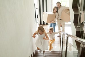 Family moving into a home | How to Buy a Home