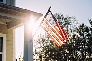 American flag outside a home | VA Home Loans