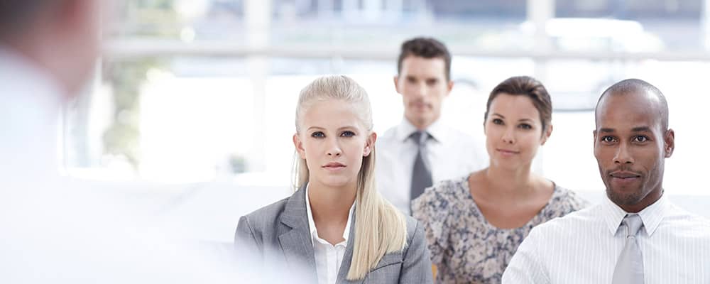 professionals listening to a speech