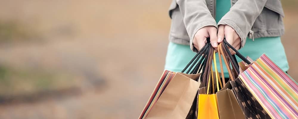 woman holding shopping bags