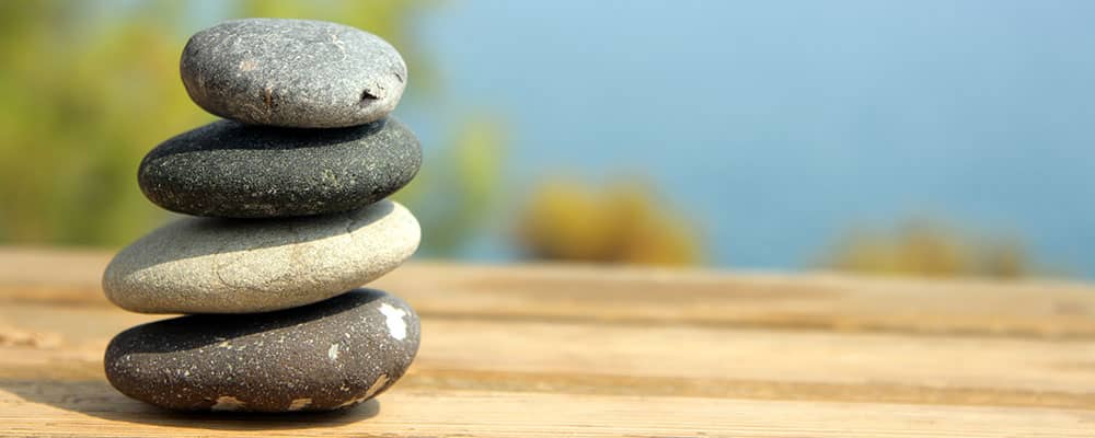 rock pile on top of a plank