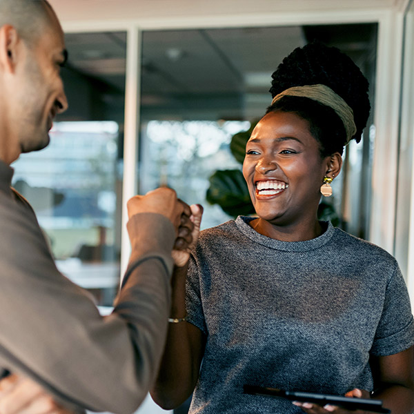 woman fist pumping a man